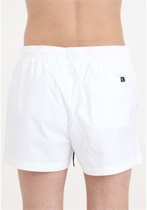 Shorts mare bianco da uomo con stampa monogram CK CALVIN KLEIN | KM0KM01015YCD